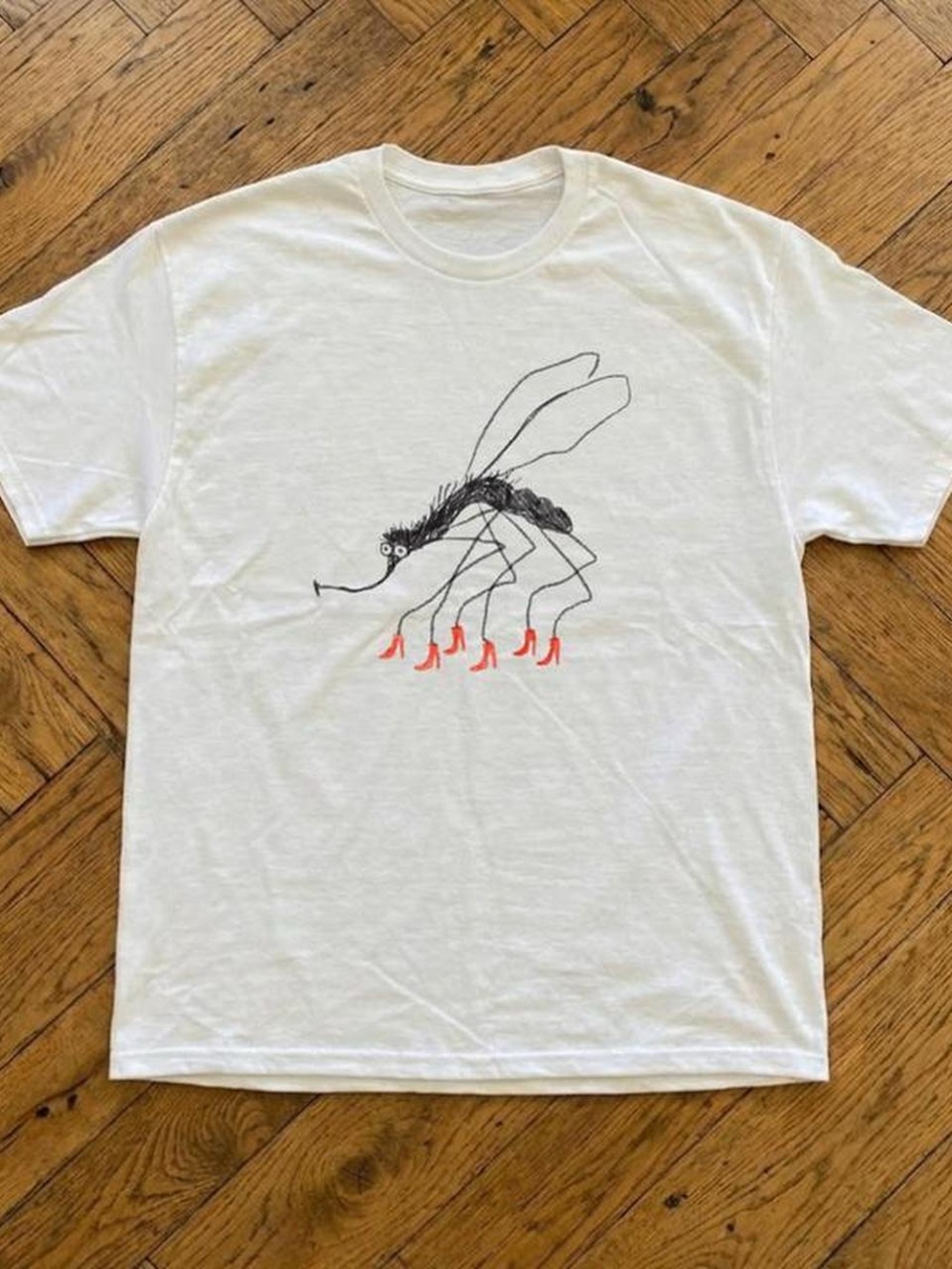 White with a mosquito wearing red high heels T shirt